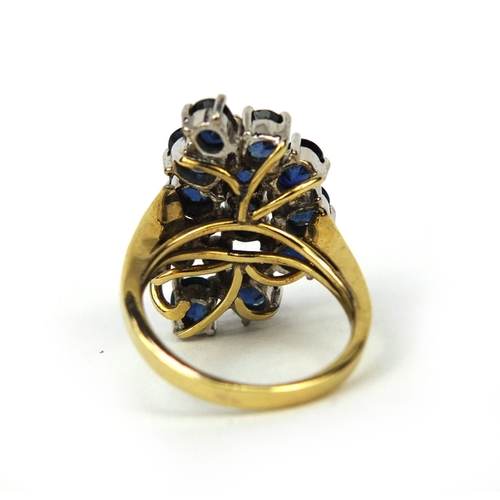 937 - 14ct gold sapphire and diamond cocktail ring set with eleven sapphires and three diamonds, size F, a... 