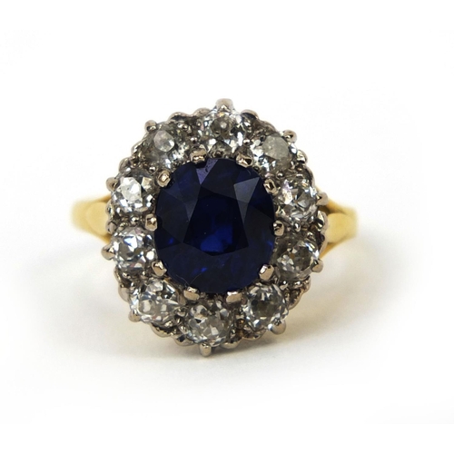 935 - 18ct gold sapphire and diamond ring set with a central sapphire surrounded by ten diamonds, size L, ... 