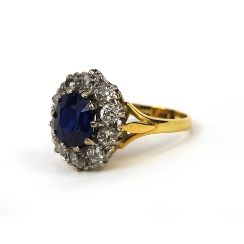 935 - 18ct gold sapphire and diamond ring set with a central sapphire surrounded by ten diamonds, size L, ... 