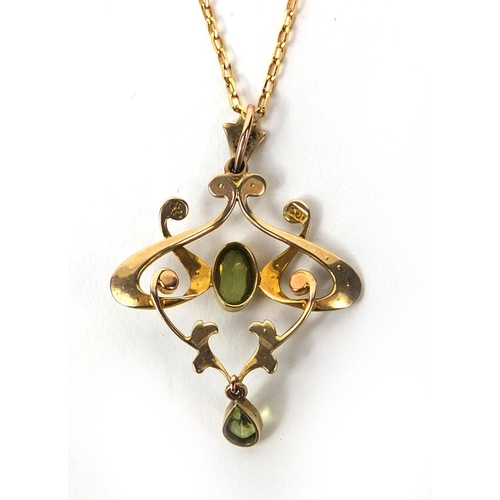 950 - Art Nouveau 9ct gold Peridot and seed pearl pendant on a 9ct gold necklace, the pendant 4.5cm long, ... 