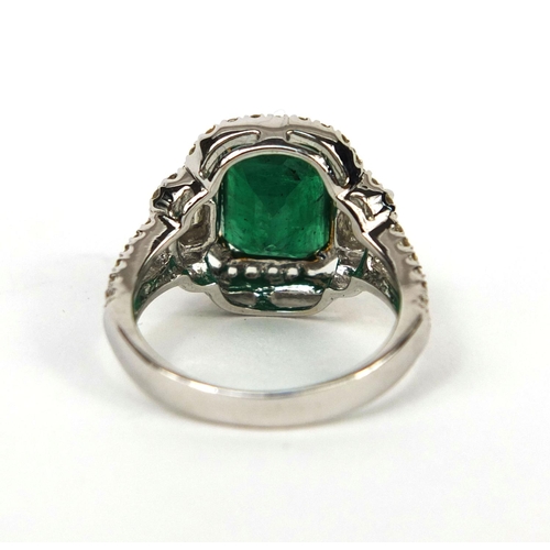 927 - 18ct white gold emerald and diamond ring, set with approximately ninety diamonds, size K, approximat... 