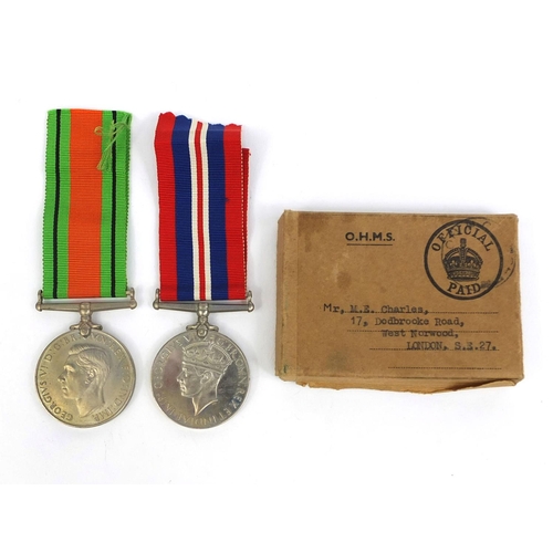 348 - British Military interest World War II defence and war medals, with box of issue awarded to Mr M E C... 