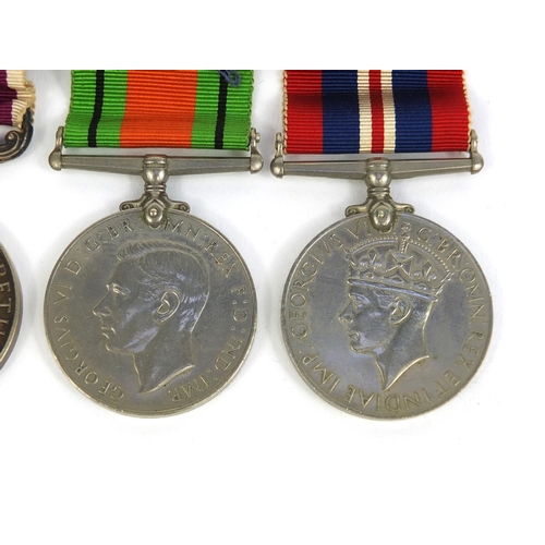 351 - British Military interest World War II medal group including a Long service and good conduct medal, ... 