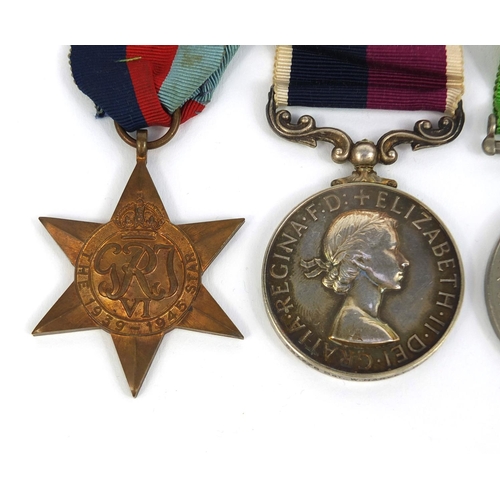 351 - British Military interest World War II medal group including a Long service and good conduct medal, ... 