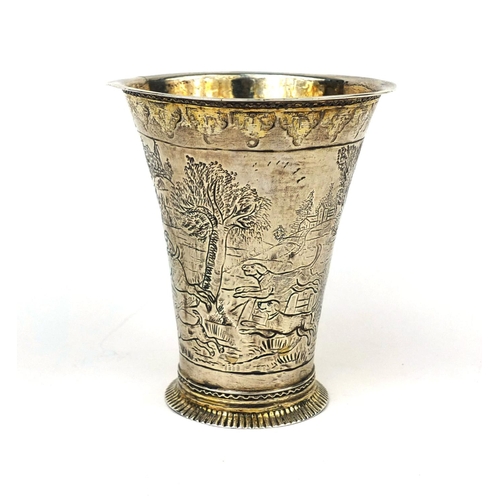 817 - 18th century silver beaker of fluted form, with gilt interior, engraved with hunting scenes, impress... 