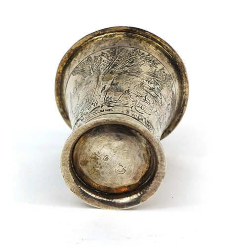 817 - 18th century silver beaker of fluted form, with gilt interior, engraved with hunting scenes, impress... 