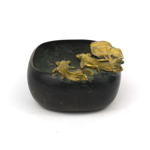 557 - Oriental bronze brush washer, mounted with gilt goldfish, four figure character marks to the base, 1... 