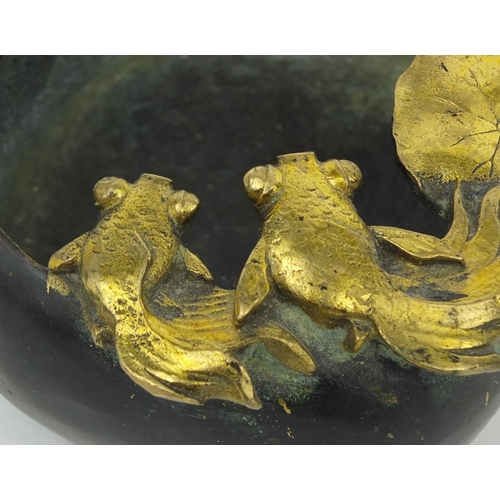 557 - Oriental bronze brush washer, mounted with gilt goldfish, four figure character marks to the base, 1... 