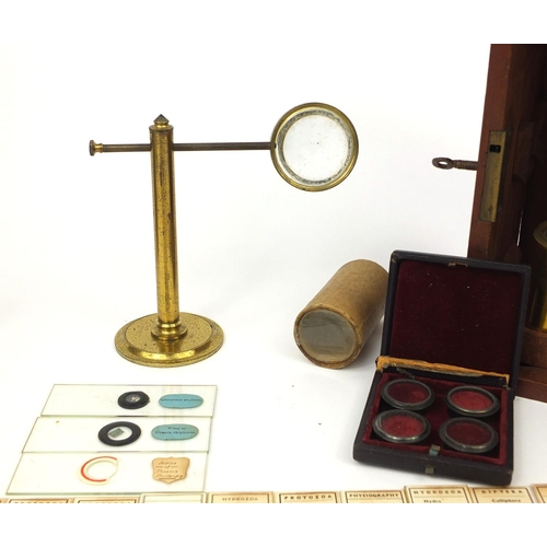 57 - Stanley of London adjustable brass microscope with fitted mahogany carrying box, together with vario... 