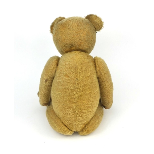 402 - Vintage straw filled teddy bear with  jointed limbs, growler and beaded glass eyes, 62cm in length