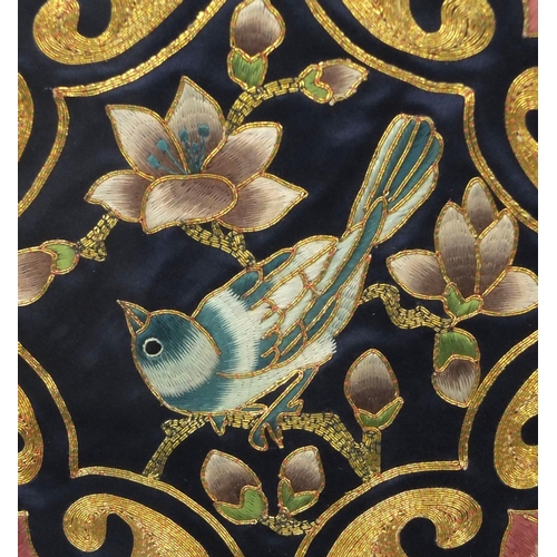 563 - Two Chinese embroidered panels, one of a bird on a branch with peaches, the other one with stylised ... 