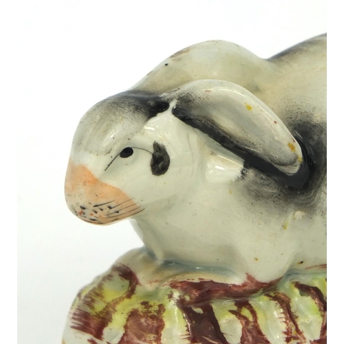 705 - Victorian Staffordshire pottery rabbit, 9.5cm in length