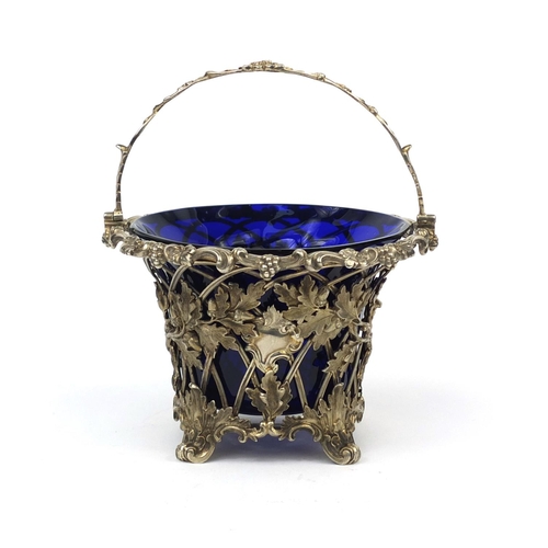 809 - Early Victorian swing handle sugar basket with wire lattice body, cast with acorns, oak leaves and f... 