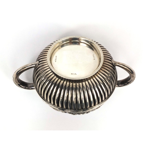 829 - American sterling silver twin handled sugar bowl and cover, profusely embossed with flowers and demi... 