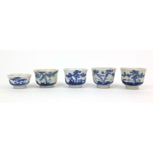 449 - Five Chinese blue and white porcelain tea bowls, each hand painted with figures and trees, some with... 