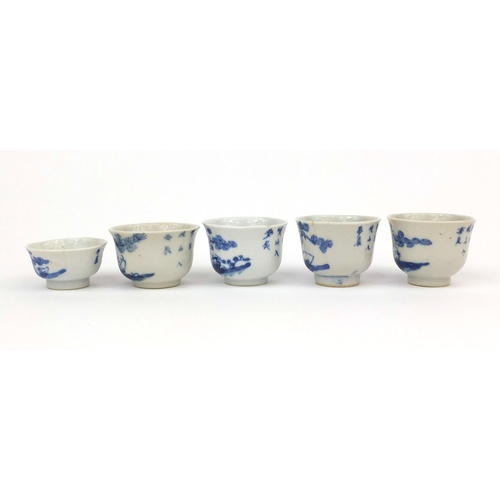 449 - Five Chinese blue and white porcelain tea bowls, each hand painted with figures and trees, some with... 