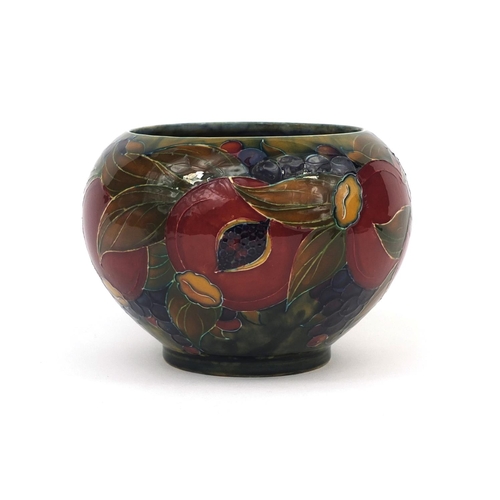 747 - William Moorcroft pomegranate pattern pottery bowl, with hand painted and tube lined decoration, fac... 