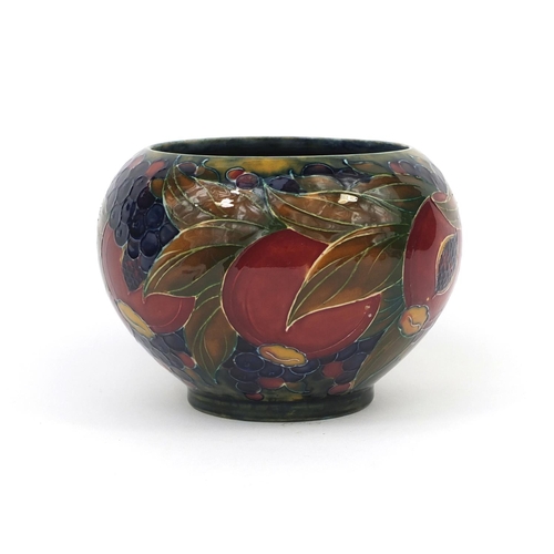 747 - William Moorcroft pomegranate pattern pottery bowl, with hand painted and tube lined decoration, fac... 