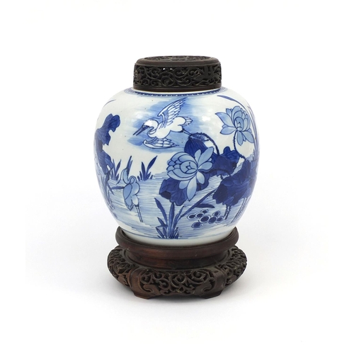 437 - Chinese blue and white porcelain ginger jar, with pierced hardwood lid and stand, hand painted with ... 