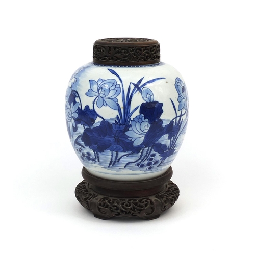 437 - Chinese blue and white porcelain ginger jar, with pierced hardwood lid and stand, hand painted with ... 