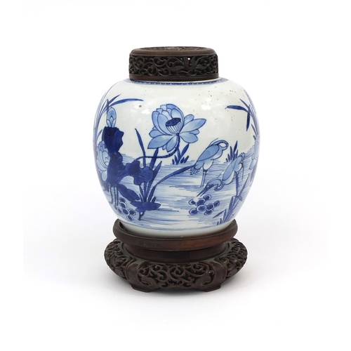 437 - Chinese blue and white porcelain ginger jar, with pierced hardwood lid and stand, hand painted with ... 