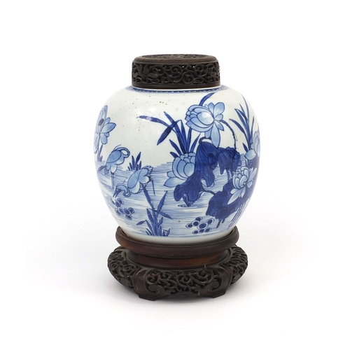 437 - Chinese blue and white porcelain ginger jar, with pierced hardwood lid and stand, hand painted with ... 