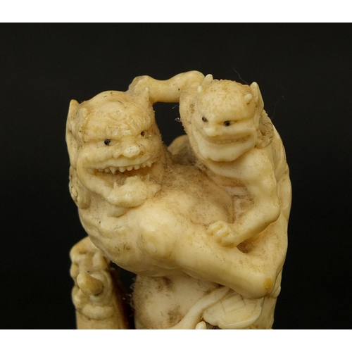 530 - Well detailed Japanese carved ivory okimono, two demons, one with a double gourd vessel, raised on a... 