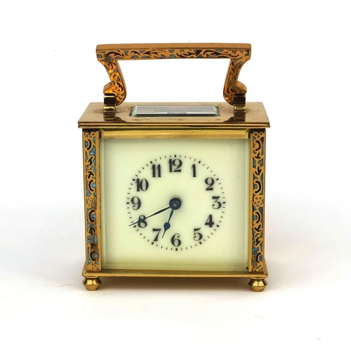 1098 - Brass cased carriage clock with enamelled decoration, bevelled glass and Arabic numerals, 8.2cm high... 