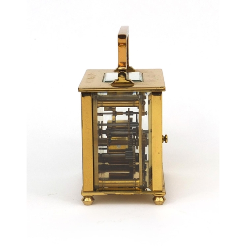 1098 - Brass cased carriage clock with enamelled decoration, bevelled glass and Arabic numerals, 8.2cm high... 