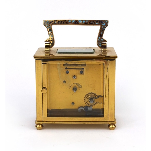 1098 - Brass cased carriage clock with enamelled decoration, bevelled glass and Arabic numerals, 8.2cm high... 