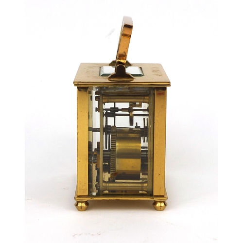 1098 - Brass cased carriage clock with enamelled decoration, bevelled glass and Arabic numerals, 8.2cm high... 