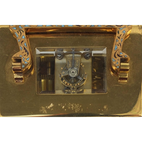 1098 - Brass cased carriage clock with enamelled decoration, bevelled glass and Arabic numerals, 8.2cm high... 