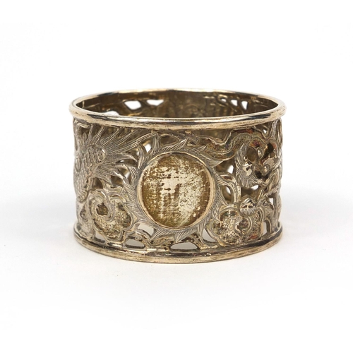 537 - Chinese silver napkin ring decorated with a dragon chasing the flaming pearl, impressed MN and chara... 