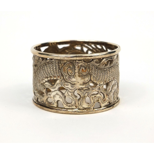 537 - Chinese silver napkin ring decorated with a dragon chasing the flaming pearl, impressed MN and chara... 