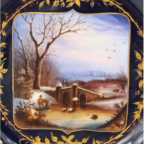 672 - Continental cabinet plate, with a central panel hand painted with a winter landscape, with gilt flor... 