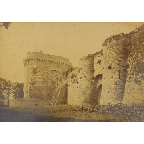 193 - Four Middle Eastern black and white photographs, one of a figure on a stairway, another with figures... 