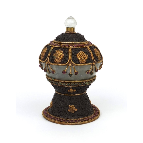 621 - Bhutan metal and rock crystal pot and cover with gilt mounts set with red and green stones, 18cm hig... 