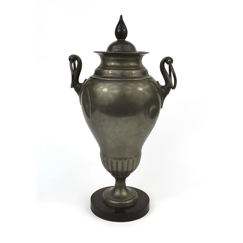 637 - Turkish pewter samovar with ring turned handles, engraved script, and ebonised knop, raised on a cir... 