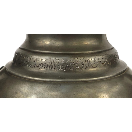 637 - Turkish pewter samovar with ring turned handles, engraved script, and ebonised knop, raised on a cir... 