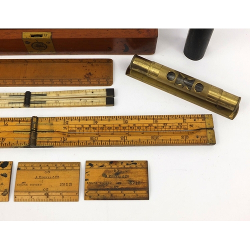 64 - Drawing instruments including a folding ivory ruler and a J Hicks of London war department mahogany ... 