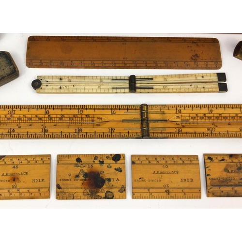 64 - Drawing instruments including a folding ivory ruler and a J Hicks of London war department mahogany ... 