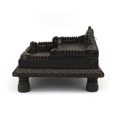 646 - Antique Middle Eastern carved wooden two tier font with iron strap work, pierced decoration and two ... 