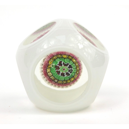 733 - White overlaid glass paperweight with colourful canes, together with a white overlaid pot with silve... 