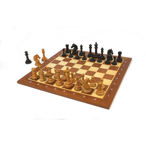 404 - Well carved half rosewood half boxwood chess set and chess board, the largest chess piece 9cm high, ... 