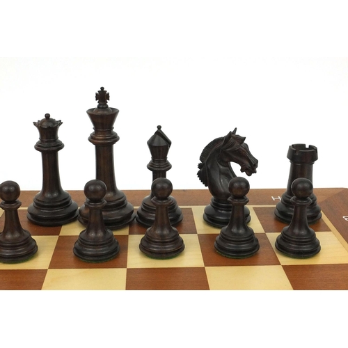 404 - Well carved half rosewood half boxwood chess set and chess board, the largest chess piece 9cm high, ... 