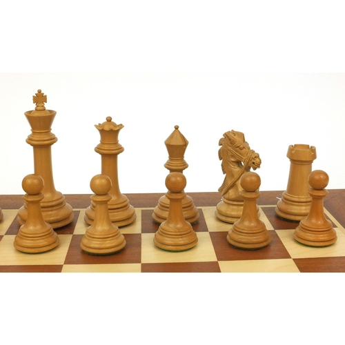 404 - Well carved half rosewood half boxwood chess set and chess board, the largest chess piece 9cm high, ... 