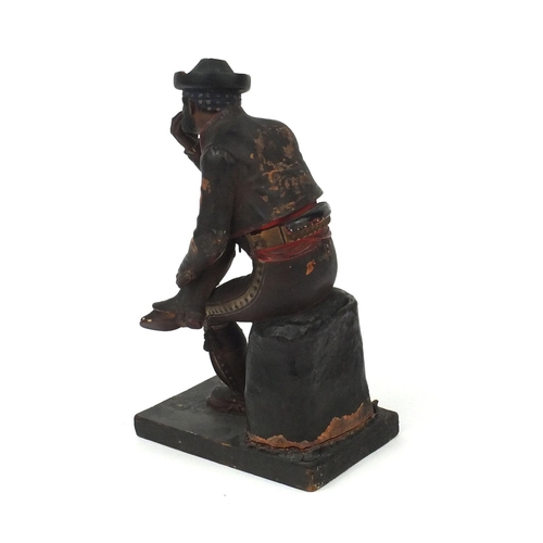 15 - 19th century Spanish polychrome painted terracotta figure of a seated pipe smoking gentleman, remnan... 