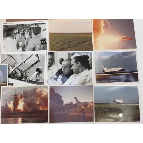 231 - Group of coloured and black and white Nasa and Space related photographs, some with Kennedy Space Ce... 