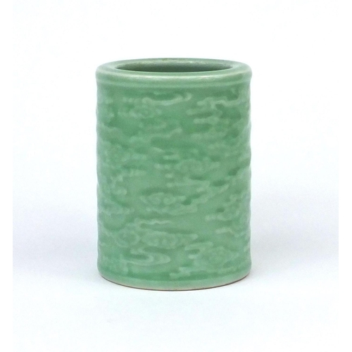 461 - Chinese celadon glazed cylindrical brush pot, decorated in low relief with a continuous band of clou... 