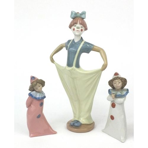 2129 - Nao clown together with three Nao Pierrots, each with factory marks to the base, the largest 30cm hi... 